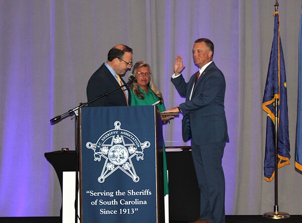 Sheriff Lee Boan, Kershaw County, with his wife, Jennifer McElveen-Boan, being sworn in as the SCSA President by Attorney General Alan Wilson.